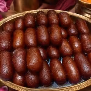 Kalojam deep-fried syrup-soaked sweet - Manha Sweets Bogura